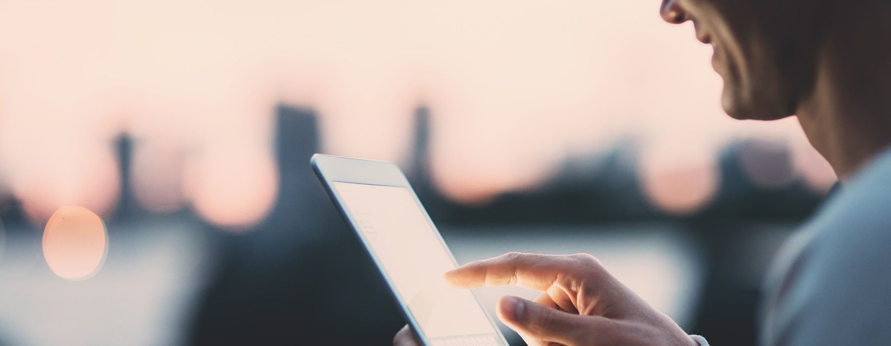 Man scrolling on a tablet